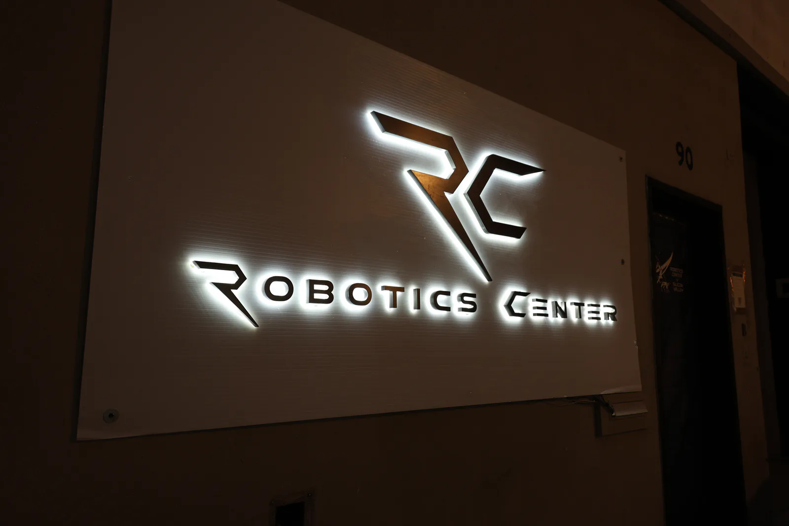 Illuminated Robotics Center sign outside the San Francisco headquarters