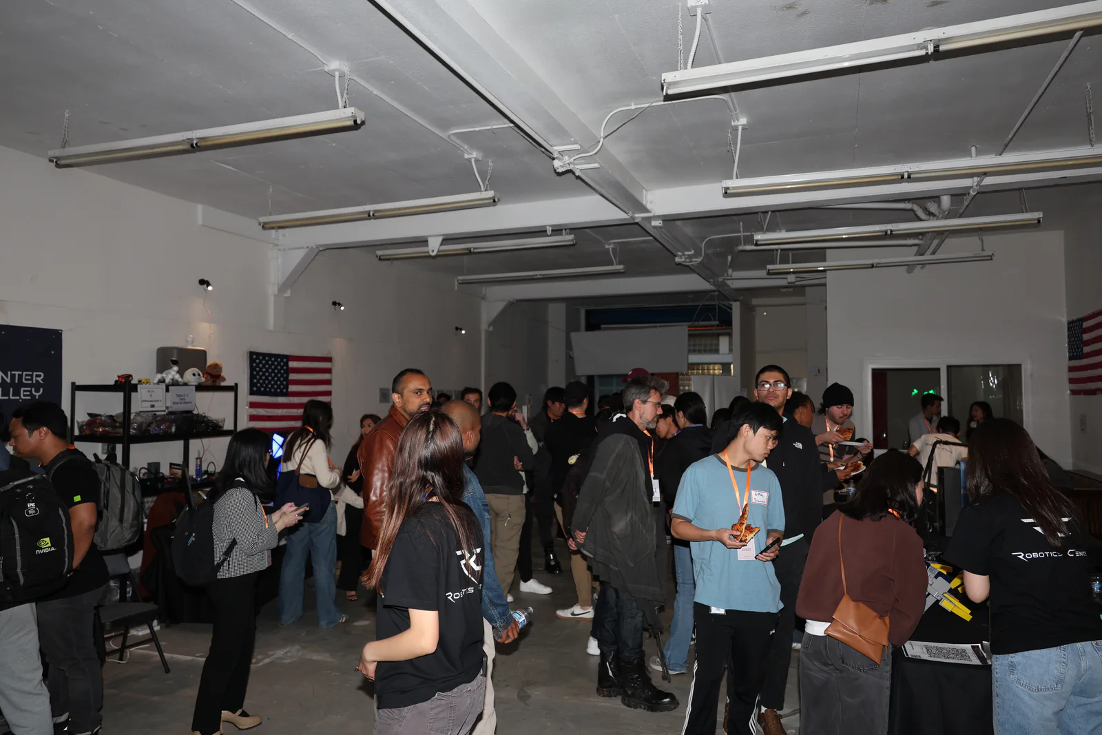 Wide view of guests networking among robot demonstrations at RCSV San Francisco