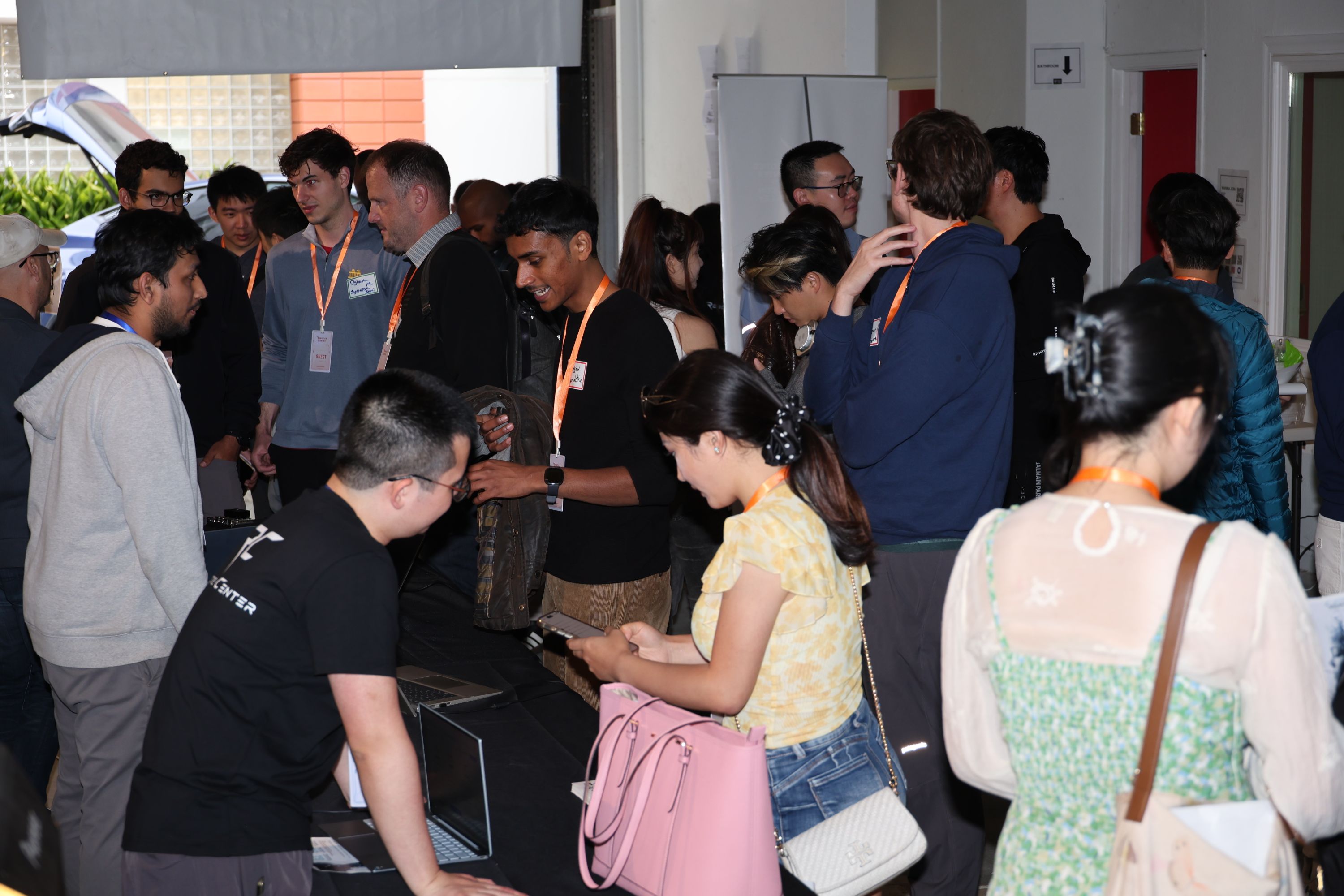 Guests gathering around a hands-on robotics demonstration at the RCSV grand opening