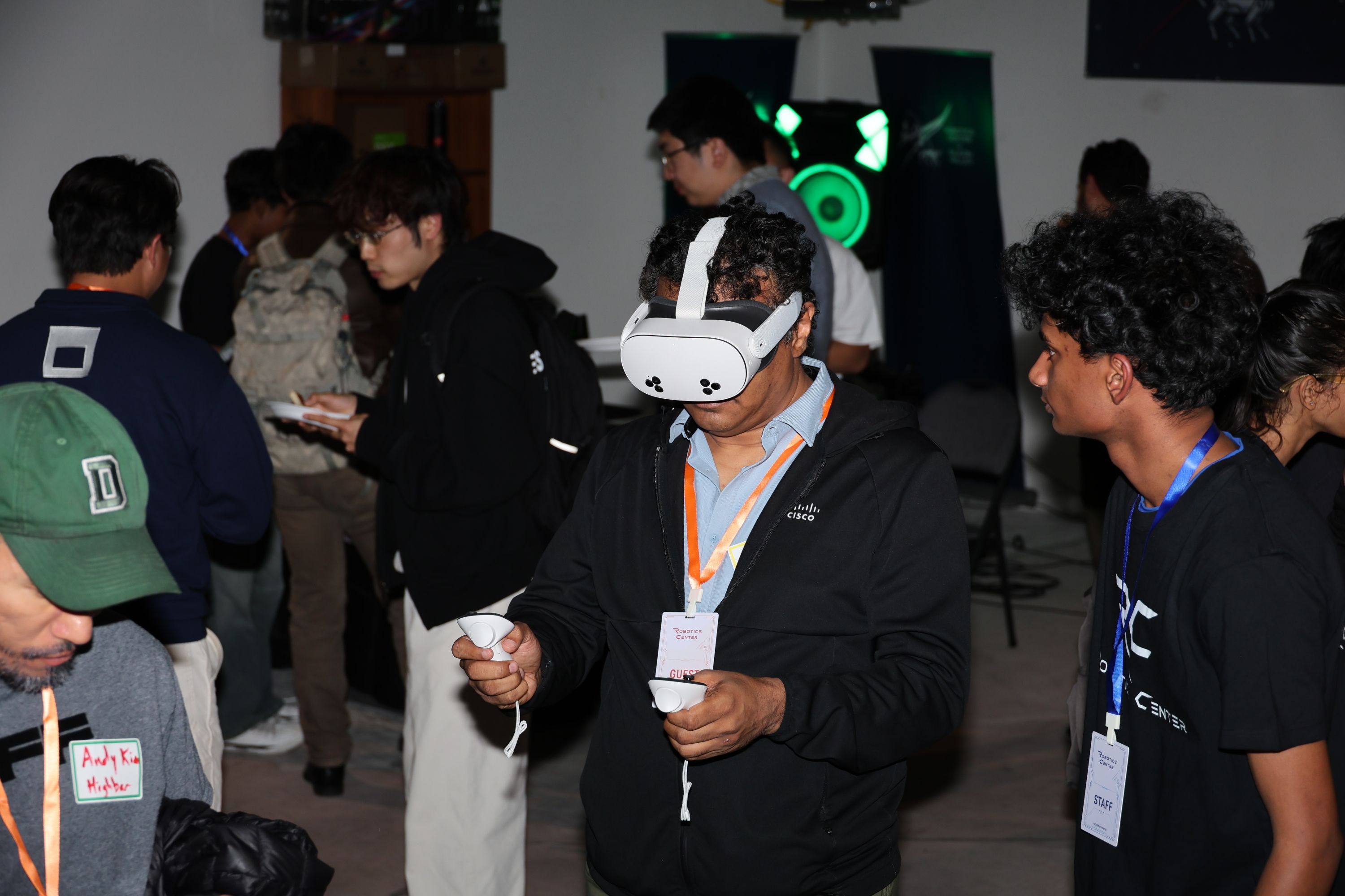 Guest trying a virtual reality headset during a robotics demonstration at RCSV