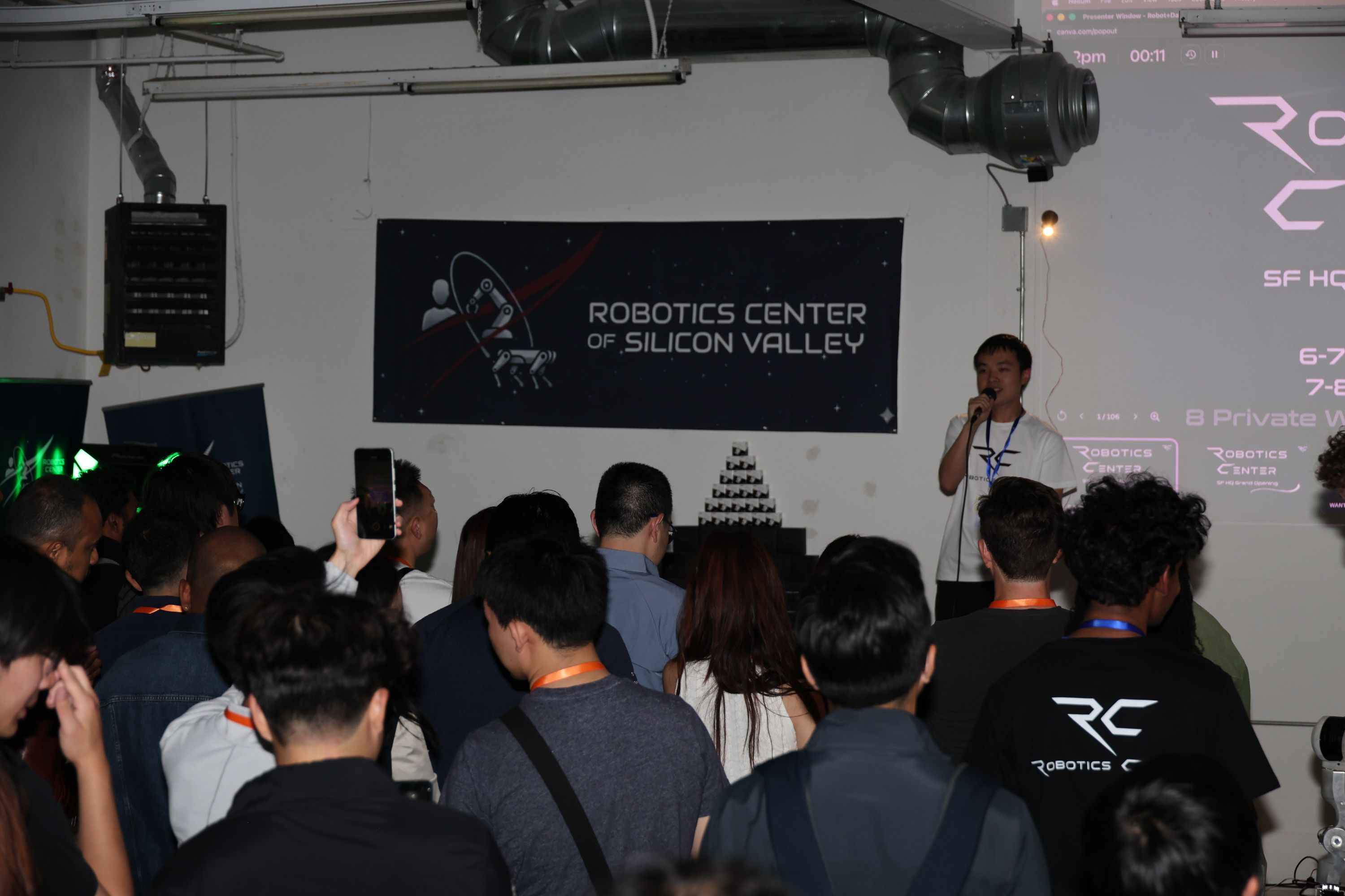 Speaker addressing a packed audience at the RCSV SF headquarters grand opening