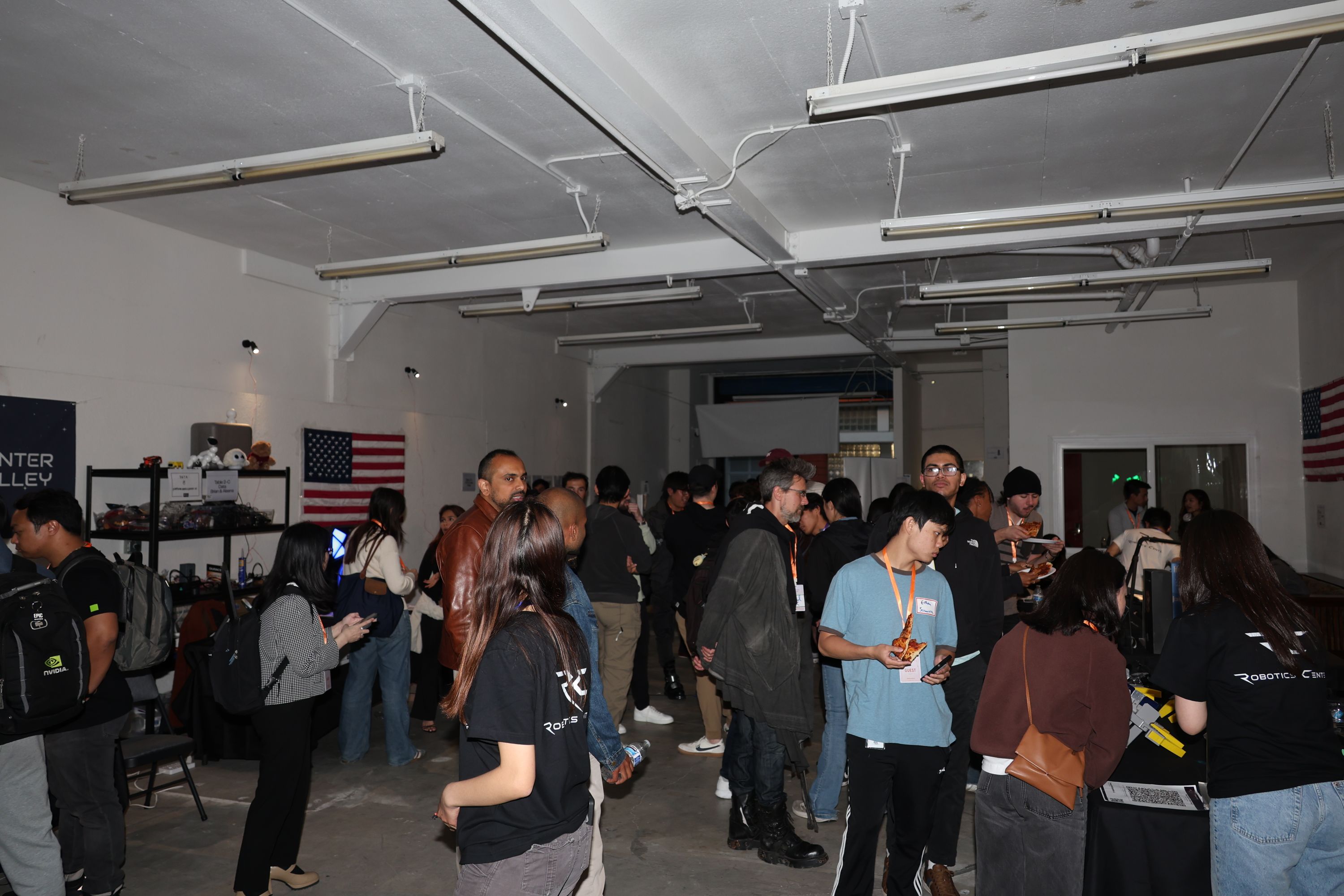 Wide view of guests networking among robot demonstrations at RCSV San Francisco